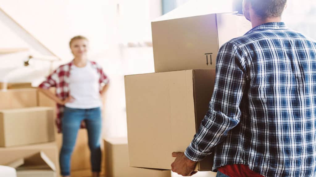 Couple With Moving Boxes — Removalist in Brisbane, QLD